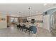 Open concept kitchen with a large island, stainless appliances, and a view of the adjacent dining area at 18032 Polo Trl, Bradenton, FL 34211