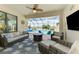 This is a serene lanai with stylish seating, a lake view, and an inviting pool at 18032 Polo Trl, Bradenton, FL 34211