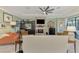 Comfortable living room featuring a fireplace, tiled floor, and neutral decor at 18032 Polo Trl, Bradenton, FL 34211