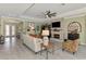 Bright living room with fireplace, tiled floor, and comfortable seating at 18032 Polo Trl, Bradenton, FL 34211