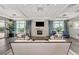 Cozy lounge area with a fireplace and comfortable seating, ideal for relaxation at 18032 Polo Trl, Bradenton, FL 34211