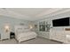 Bright, airy main bedroom featuring neutral colors, tray ceilings, and large windows with a view at 18032 Polo Trl, Bradenton, FL 34211