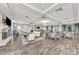 Spacious meeting room with a fireplace, comfortable seating, and plenty of natural light at 18032 Polo Trl, Bradenton, FL 34211