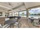 Outdoor community patio with several seating areas, ceiling fans, and a view of the neighborhood pool at 18032 Polo Trl, Bradenton, FL 34211
