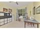 This is a bright room with a sewing machine, fabric storage and carpet at 18032 Polo Trl, Bradenton, FL 34211