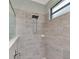 Walk-in shower with neutral tile at 18032 Polo Trl, Bradenton, FL 34211