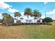 Polo Run community sign with professional landscaping and lantern accents at 18032 Polo Trl, Bradenton, FL 34211