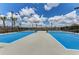 New tennis courts with black fencing, professional surfacing, and views of the community landscaping at 18032 Polo Trl, Bradenton, FL 34211