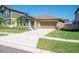 Single-Gathering home with a well-kept lawn, a two-car garage, and a concrete driveway at 22111 Nebula Way, Land O Lakes, FL 34637