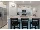 Open-concept kitchen featuring stainless steel appliances, gas range and island with sink at 22111 Nebula Way, Land O Lakes, FL 34637