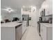 Bright kitchen features white cabinetry, stainless steel appliances, and an island with a breakfast bar at 22111 Nebula Way, Land O Lakes, FL 34637