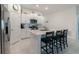 Open-concept kitchen featuring stainless steel appliances, gas range and island with sink at 22111 Nebula Way, Land O Lakes, FL 34637