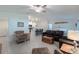 Open-concept floor plan featuring a spacious living room connected to the modern kitchen at 22111 Nebula Way, Land O Lakes, FL 34637