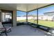 Relaxing screened patio with seating, offering an enjoyable view of the backyard and surrounding landscape at 22111 Nebula Way, Land O Lakes, FL 34637
