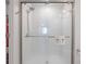 Modern bathroom shower showcasing subway tile, glass enclosure, and sleek shower fixtures at 22111 Nebula Way, Land O Lakes, FL 34637