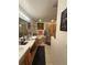 Bright bathroom featuring a soaking tub, a separate shower, and double vanity sinks, offering a spa-like experience and functionality at 227 Golden Harbour Trail Way, Bradenton, FL 34212