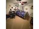 Decorated bedroom with space themed bedding, desk area, and playful wall accents at 227 Golden Harbour Trail Way, Bradenton, FL 34212