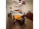 Warm bedroom featuring ceiling fan, queen bed with colorful pillows, dresser, and cozy furniture at 227 Golden Harbour Trail Way, Bradenton, FL 34212
