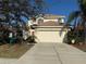 Charming two-story home showcasing a well-maintained lawn and a spacious two-car garage in a quiet neighborhood at 227 Golden Harbour Trail Way, Bradenton, FL 34212