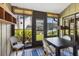 Enclosed patio with large windows and a dining table at 2626 Moss Oak Dr # 51, Sarasota, FL 34231