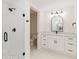 Bathroom featuring a glass enclosed shower, toilet, and double vanity with a modern light fixture at 280 Hidden Bay Dr # 202, Osprey, FL 34229