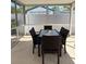 Cozy screened patio with a dining table and chairs, perfect for outdoor meals at 3013 Yarmouth W Dr, Bradenton, FL 34205