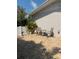 Brick patio with outdoor seating and surrounding landscaping at 3013 Yarmouth W Dr, Bradenton, FL 34205