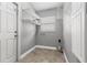 Practical laundry room featuring tile flooring, built-in shelves, and utility connections at 3106 45Th E Ave, Bradenton, FL 34203