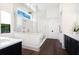 Contemporary bathroom featuring a glass-enclosed shower, double vanity, and modern fixtures at 329 Bird Key Dr, Sarasota, FL 34236