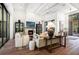 Bright living room featuring a fireplace, stylish decor, and comfortable seating arrangements at 329 Bird Key Dr, Sarasota, FL 34236