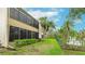 Outdoor patio with a view of the lush, green backyard and the exterior of the property at 333 Springdale Dr # 333, Bradenton, FL 34210