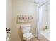 Cozy bathroom featuring a toilet, shower with a curtain, and a decorative hand towel hanging on the wall at 333 Springdale Dr # 333, Bradenton, FL 34210