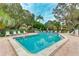 Sparkling community pool featuring lounge chairs, surrounding greenery, and a tranquil atmosphere at 333 Springdale Dr # 333, Bradenton, FL 34210