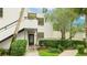 Condo's facade showcases a private entrance, stairway, and tasteful landscaping at 333 Springdale Dr # 333, Bradenton, FL 34210