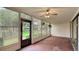 Enclosed lanai with ceiling fan and views of the garden at 333 Springdale Dr # 333, Bradenton, FL 34210