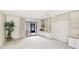 Spacious living area featuring built-in shelving and sliding glass doors to the lanai at 333 Springdale Dr # 333, Bradenton, FL 34210