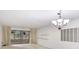 Open living area with sliding glass doors at 333 Springdale Dr # 333, Bradenton, FL 34210