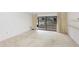Open living room with sliding glass doors to lanai, perfect for relaxing or entertaining at 333 Springdale Dr # 333, Bradenton, FL 34210