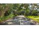 A picturesque street view lined with lush trees and landscaping offers a tranquil and inviting neighborhood setting at 333 Springdale Dr # 333, Bradenton, FL 34210