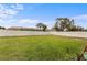 Expansive backyard featuring a well-manicured lawn and pristine white privacy fence at 3512 21St W Ave, Bradenton, FL 34205