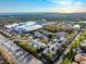 Expansive aerial view captures IMG Academy's facilities, with tennis courts, modern buildings, and lush landscaping at 3608 54Th W Dr # 102, Bradenton, FL 34210
