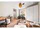 Sunlit room featuring wood floors, bike, closet, and modern decor at 3608 54Th W Dr # 102, Bradenton, FL 34210