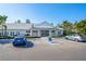 Exterior of the clubhouse and parking area featuring handicap accessible parking at 3608 54Th W Dr # 102, Bradenton, FL 34210