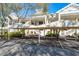 Inviting condo complex with covered parking, lush landscaping, and charming architecture at 3608 54Th W Dr # 102, Bradenton, FL 34210
