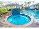 Beautiful hot tub with surrounding tilework and handrails for easy access and safety at 3608 54Th W Dr # 102, Bradenton, FL 34210