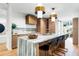 Stylish kitchen with pendant lighting, wood cabinets, stainless appliances, and an eat-in island at 3608 54Th W Dr # 102, Bradenton, FL 34210