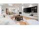 Open-concept living room with coffered ceilings, fireplace and doors to the outdoors at 3608 54Th W Dr # 102, Bradenton, FL 34210