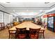 Large meeting room featuring a long conference table, neutral colors, and a beverage fridge at 3608 54Th W Dr # 102, Bradenton, FL 34210