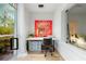 Bright office space boasts a modern desk and views of the surrounding landscape at 3608 54Th W Dr # 102, Bradenton, FL 34210