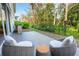 Outdoor patio featuring comfortable seating to enjoy the lush surroundings at 3608 54Th W Dr # 102, Bradenton, FL 34210